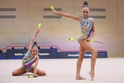 Gymnasts during an exercise with clubs