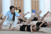 Academy coach Elizaveta Chernova and  Gymnast from Belgorod  during class