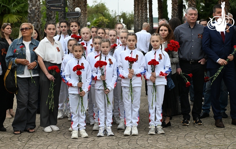 Academy students laid flowers to the Memorial Sign for workers of the Southern Crops state-owned farm
