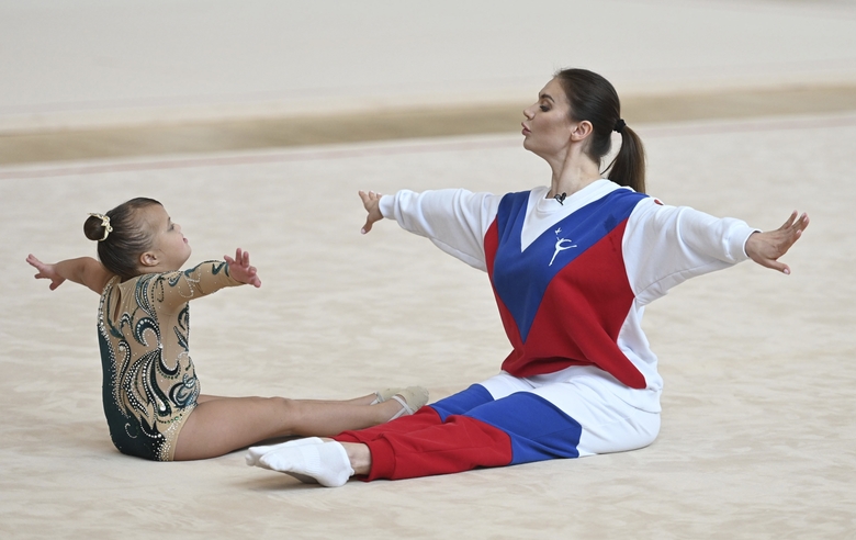 June 1, 2023. Olympic champion Alina Kabaeva a during training session with a participant of the Academy charitable training camp