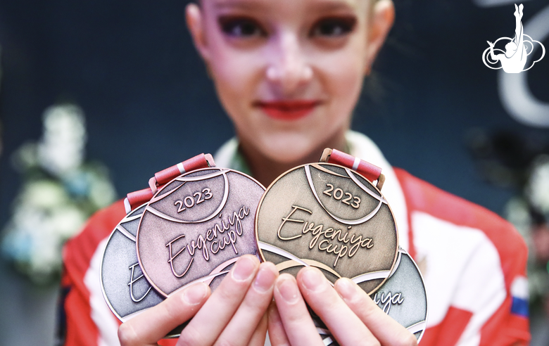 Gymnast with awards following the results of the EVGENIYA CUP tournament