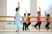 Choreographer Ekaterina Belova and gymnasts during a class