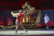 Tournament champion Lala Kramarenko appears on the floor together with Chinese artists and a team from St. Petersburg in the Dragon performance