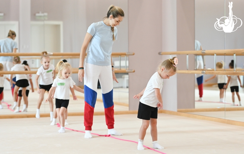 Academy coach Olga Frolova with young gymnasts during a lesson