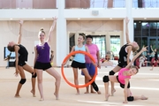 Gymnast with coach Galina Goncharuk during a lesson