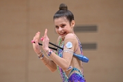 Karolina Tarasova during an exercise with clubs at a control training session