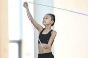 Chinese gymnast performs an exercise with a jump rope