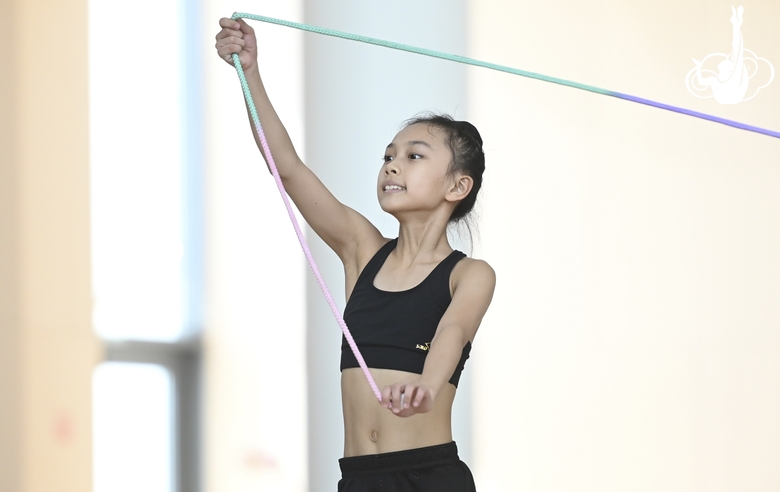 Chinese gymnast performs an exercise with a jump rope