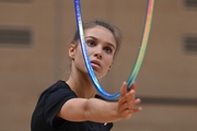 Gymnast during an exercise with a hoop during floor testing