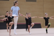 Academy coach Olga Frolova with young gymnasts