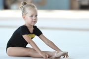 Young gymnast during training