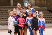 Alina Kabaeva together with gymnasts from the Leningrad region and their coach