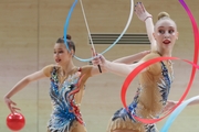 Gymnasts during an exercise with balls and ribbons