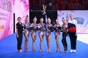Choreographer Ekaterina Belova, the Academy group gymnasts, and their coach Anna Ustsova after the awards ceremony