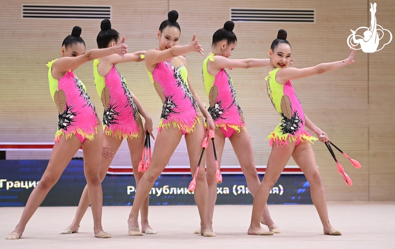 Gymnasts during an exercise with clubs