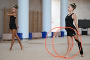 Gymnasts performing an exercise with hoops