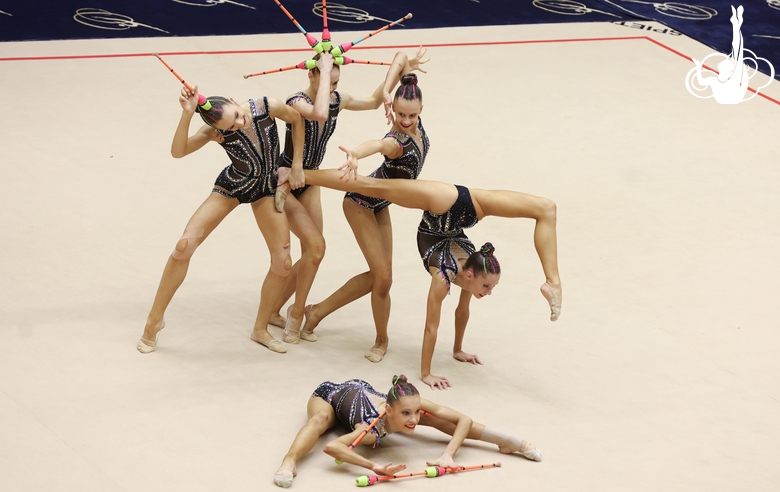 Gymnast during an exercise with clubs