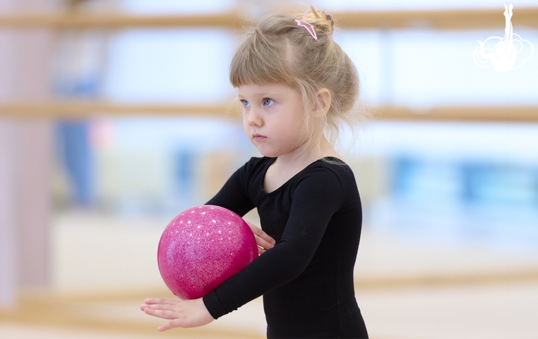 Young gymnast during the ball exercise