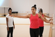 Coach Pooja Surve and gymnasts during choreography