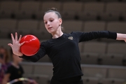 Gymnast during an exercise with a ball during floor testing