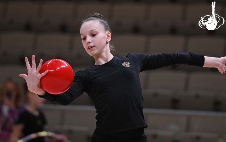 Gymnast during an exercise with a ball during floor testing