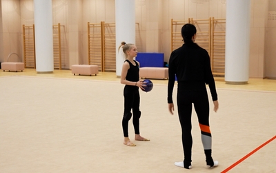 Alina Kabaeva along with coach Evgenia Eliseeva and choreographer Natalia Belugina is suggesting Eva Kononova how to play out an interesting accent