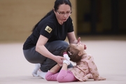 Academy Coach Alla Mishenina with a young gymnast during the selection