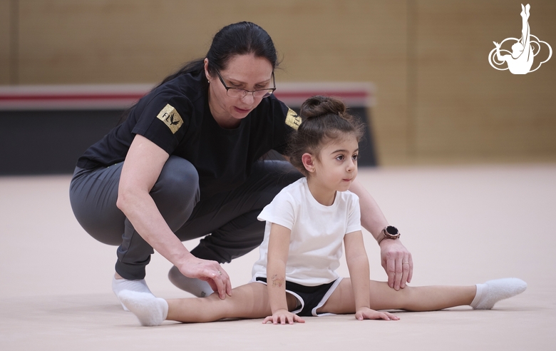 Academy Coach Alla Mishenina with a young gymnast during the selection