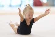 Young gymnast during training