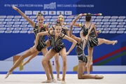 Gymnasts during an exercise with clubs