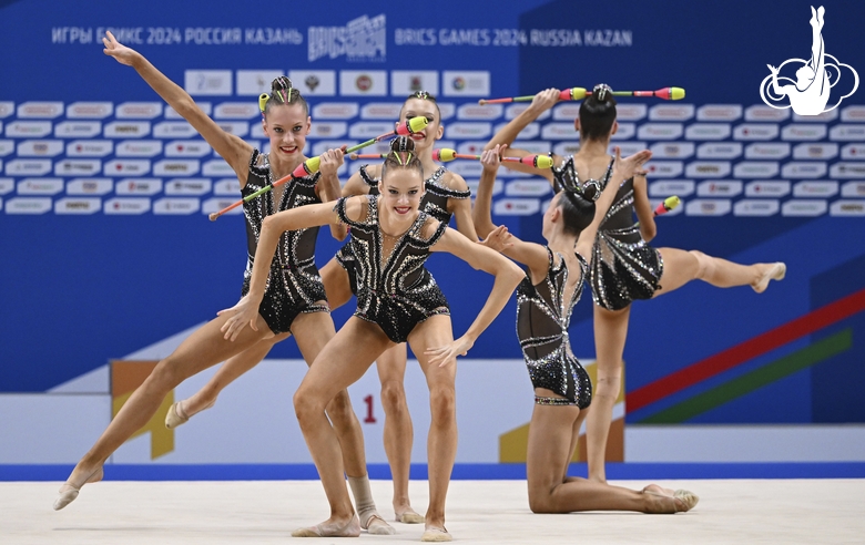 Gymnasts during an exercise with clubs