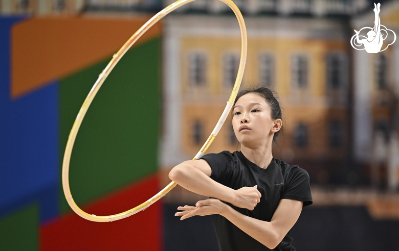 Gymnast perform exercises with a hoop during floor testing before the BRICS Games