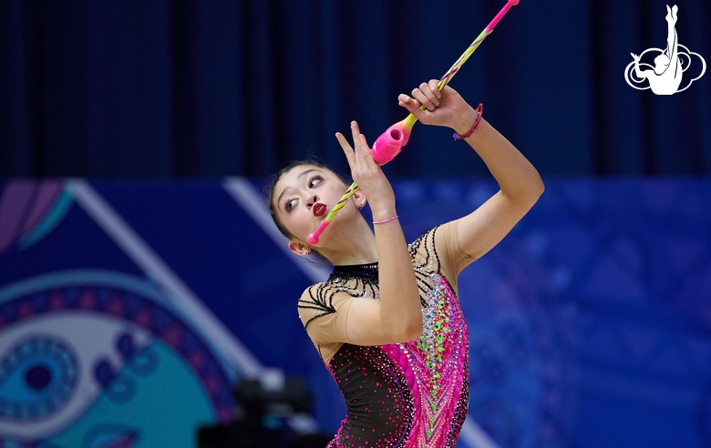 Lola Djuraeva during an exercise with clubs