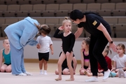 Academy coaches with young gymnasts during the selection process