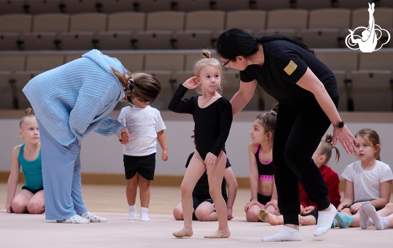 Academy coaches with young gymnasts during the selection process