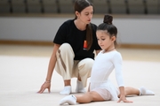 Academy coach Elizaveta Chernova with a young gymnast during the selection process