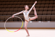 Gymnast performing with a hoop at an assessment training session