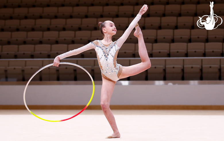 Gymnast performing with a hoop at an assessment training session