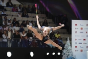 Natalia Usova (Uzbekistan) doing an exercise with clubs