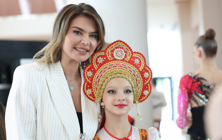 June 19, 2025. Olympic champion Alina Kabaeva with a young gymnast at a stage of the Cup of the Strongest at the Academy