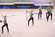 Gymnasts during an exercise with balls and ribbons