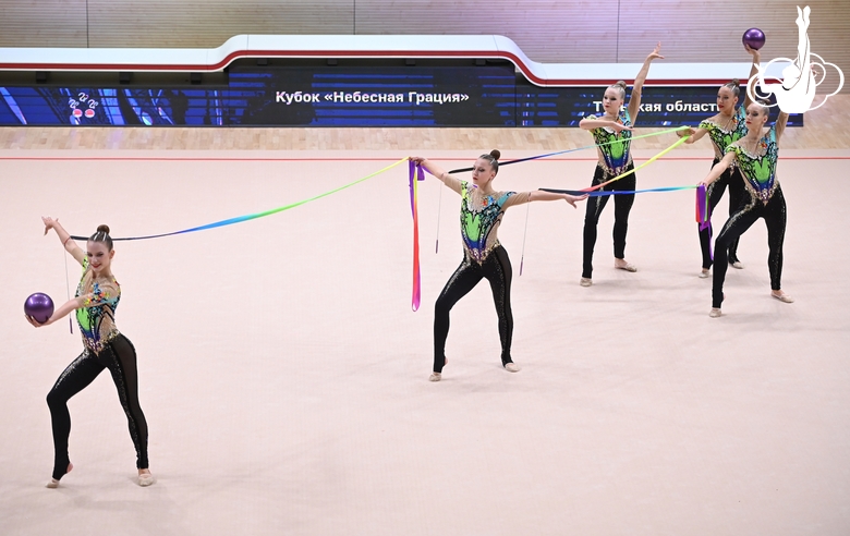 Gymnasts during an exercise with balls and ribbons