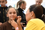 student Valeria Medvedeva in the face painting area