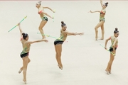 Gymnasts during an exercise with clubs