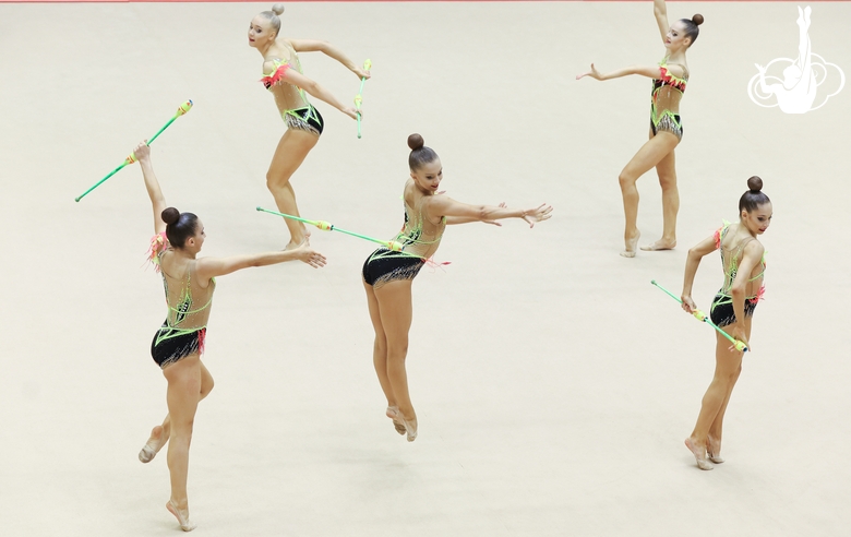 Gymnasts during an exercise with clubs