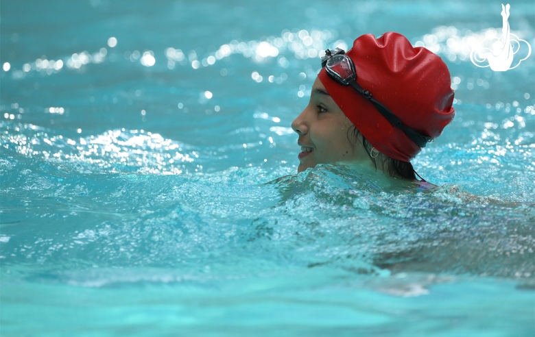 A participant of the training camp at the Academy swimming pool