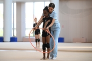 Academy coach Elizaveta Chernova with gymnast Nkenko Sita Davina Chanselvi during the training session