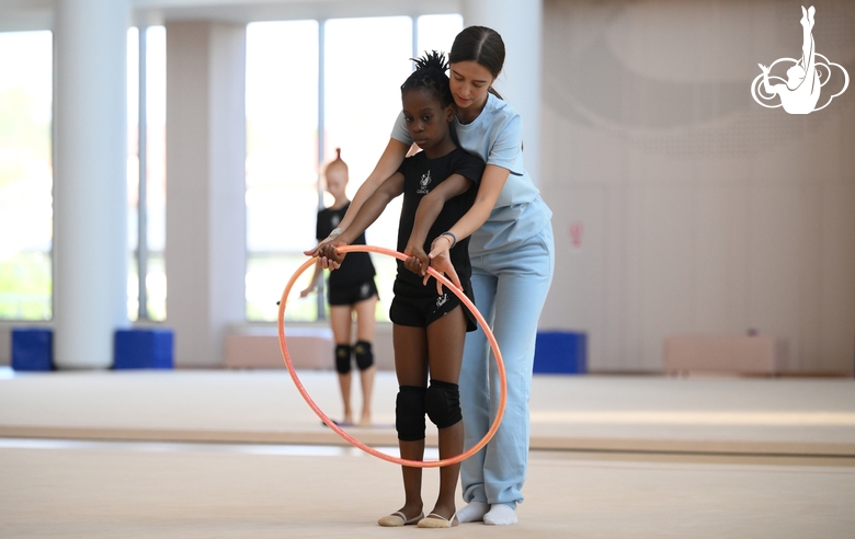 Academy coach Elizaveta Chernova with gymnast Nkenko Sita Davina Chanselvi during the training session