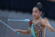 A gymnast during the exercise with clubs