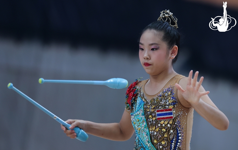 A gymnast during the exercise with clubs